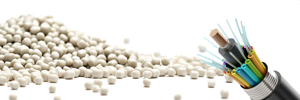 PVC elastomer polymer pellets with cross-section of fiber optic cable - Teknor Apex IWCS webinar on cable solutions.